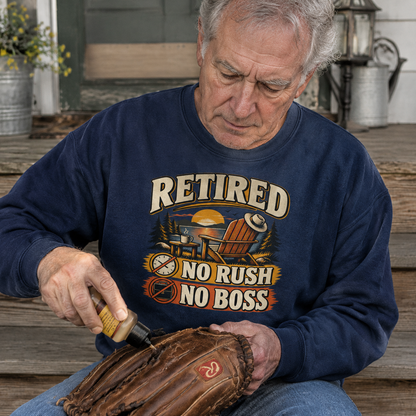 Senior man wearing navy vintage sweatshirt with printed Retired No Rush No Boss design outdoors