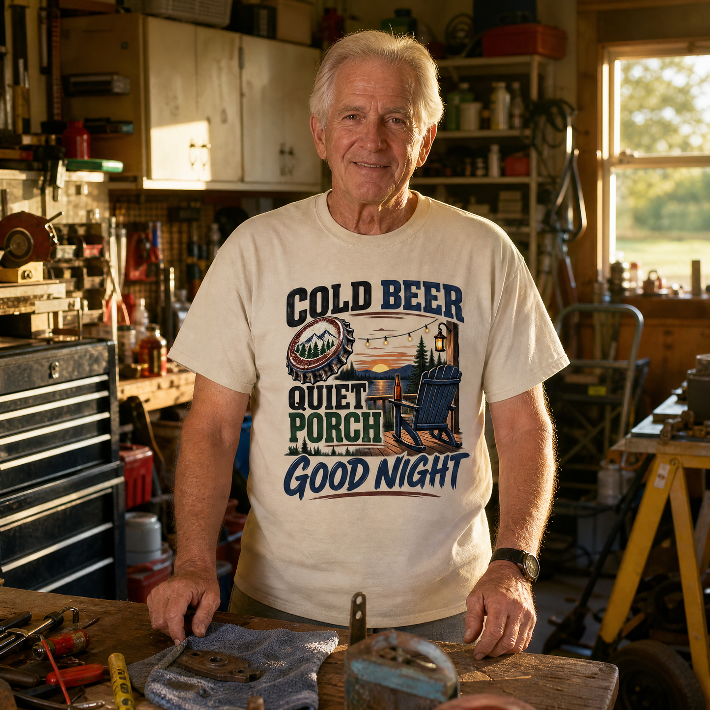 Vintage t-shirt with printed Cold Beer Quiet Porch Good Night design, worn by senior man in workshop.