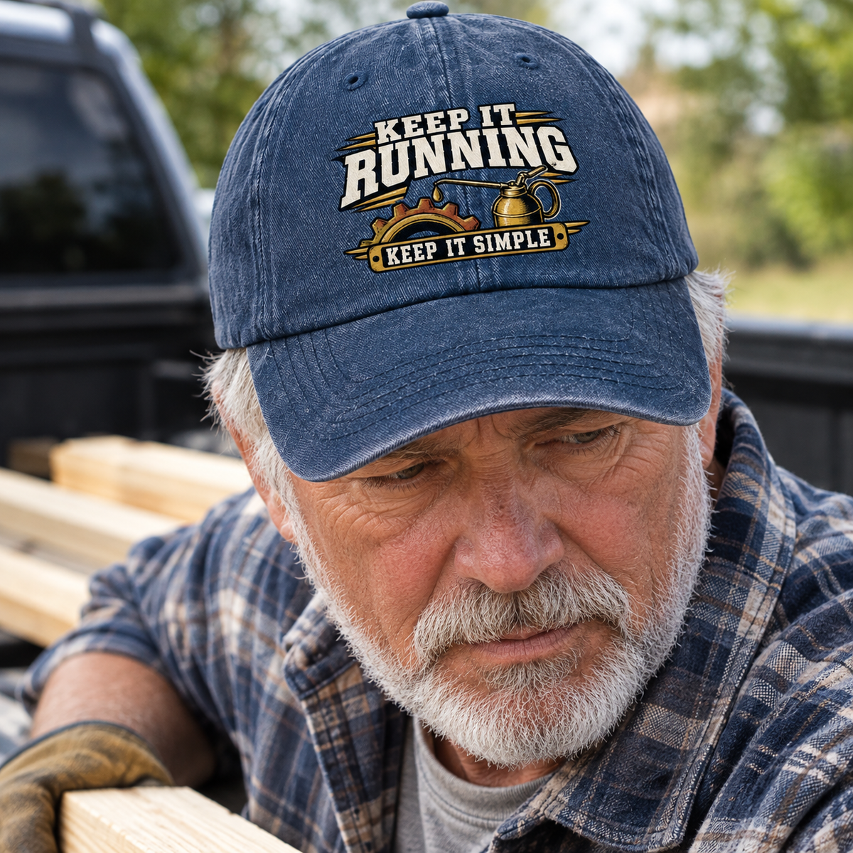 Vintage washed cap with printed Keep It Running Keep It Simple slogan on senior man