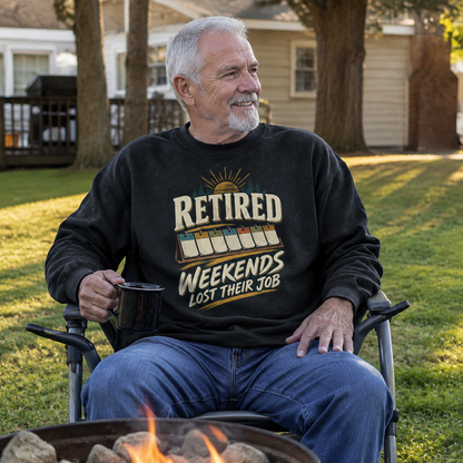Senior man wearing black vintage sweatshirt with printed Retired Weekends Lost Their Job slogan outdoors