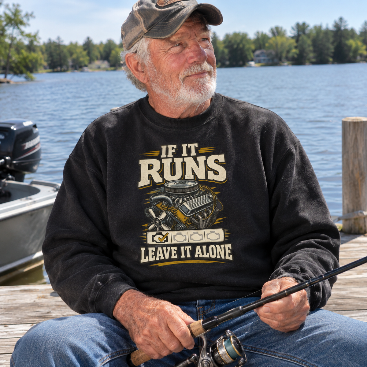 sweatshirt reading If It Runs Leave It Alone, fishing lakeside