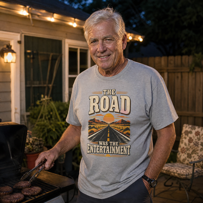 Senior man wearing gray vintage t-shirt with The Road Was The Entertainment print outdoors