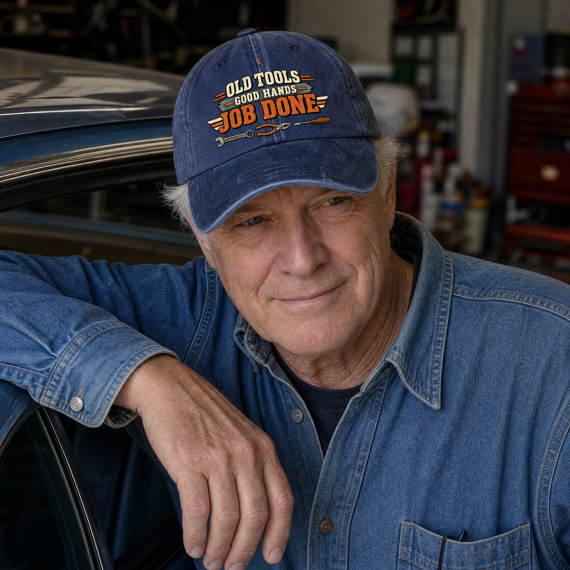 Senior man wearing blue vintage washed cap with printed Old Tools Good Hands Job Done