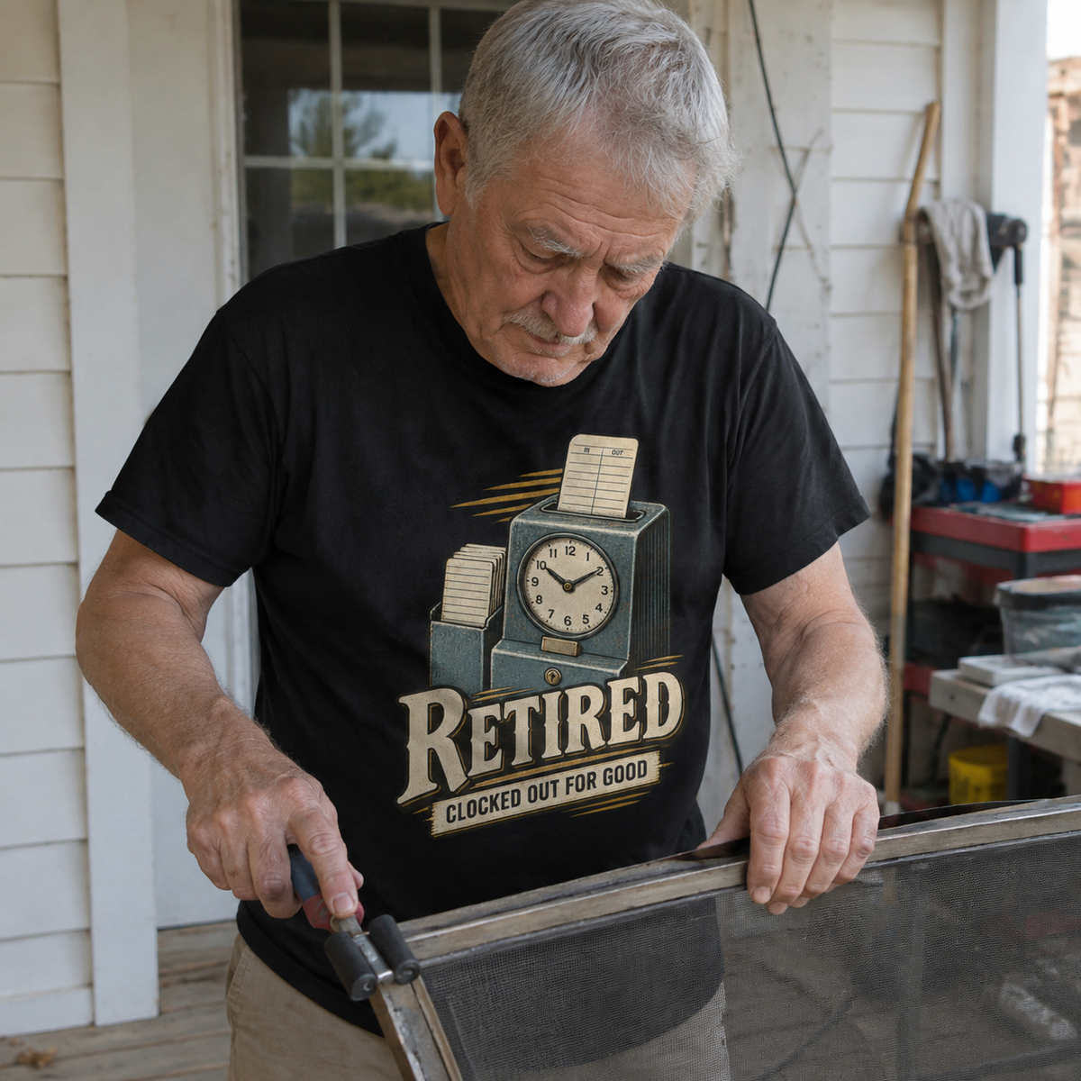 Black vintage t-shirt with Clocked Out For Good print, senior man in outdoor lifestyle view