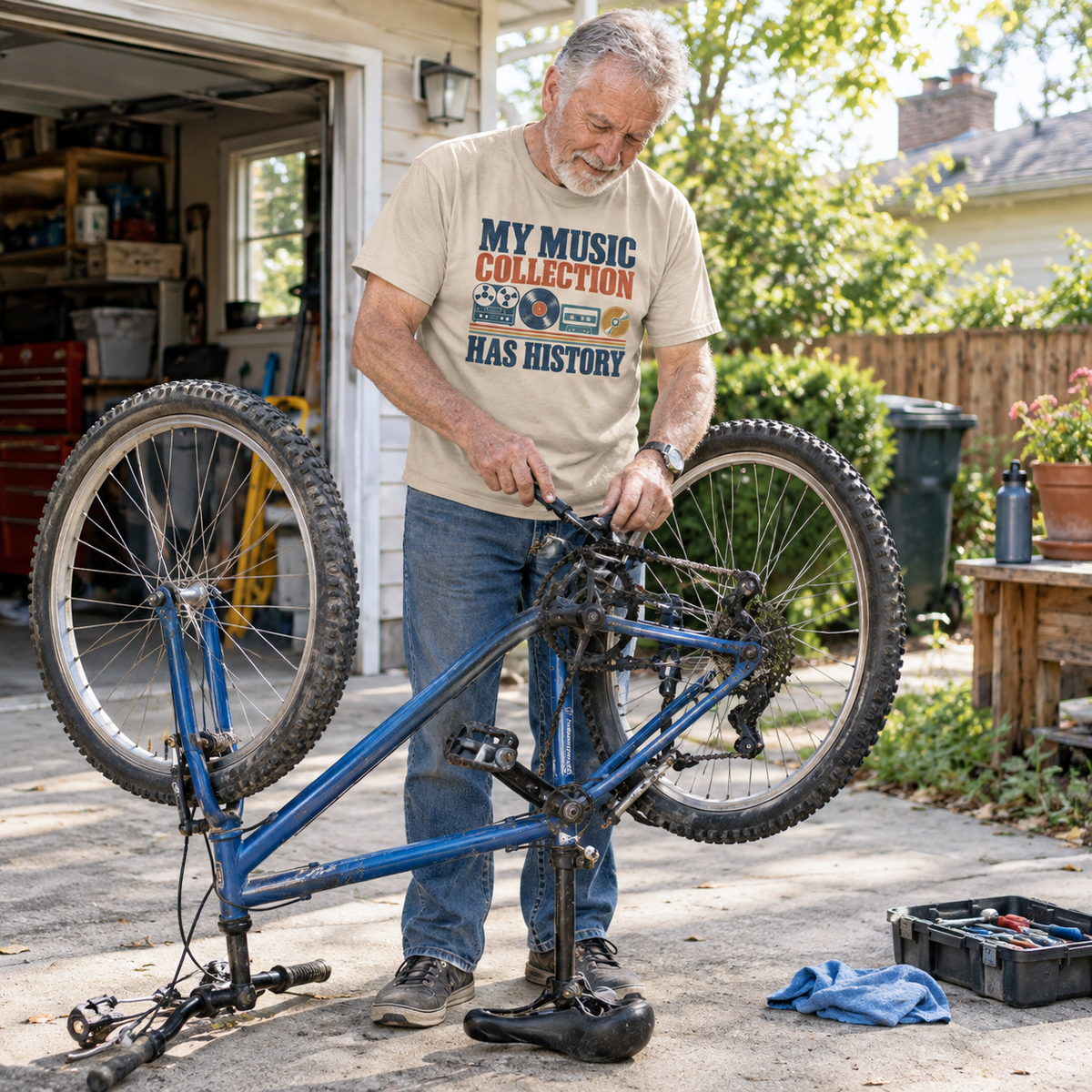 Senior man wearing vintage t-shirt with printed My Music Collection Has History design outdoors