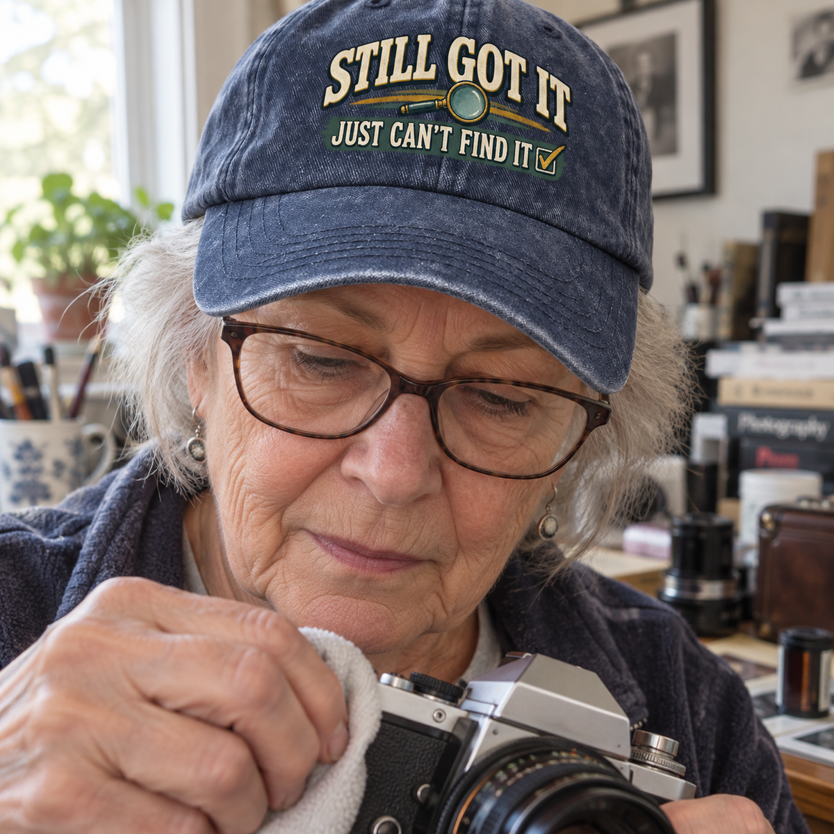 Senior woman wears navy vintage washed cap printed Still Got It Just Can't Find It