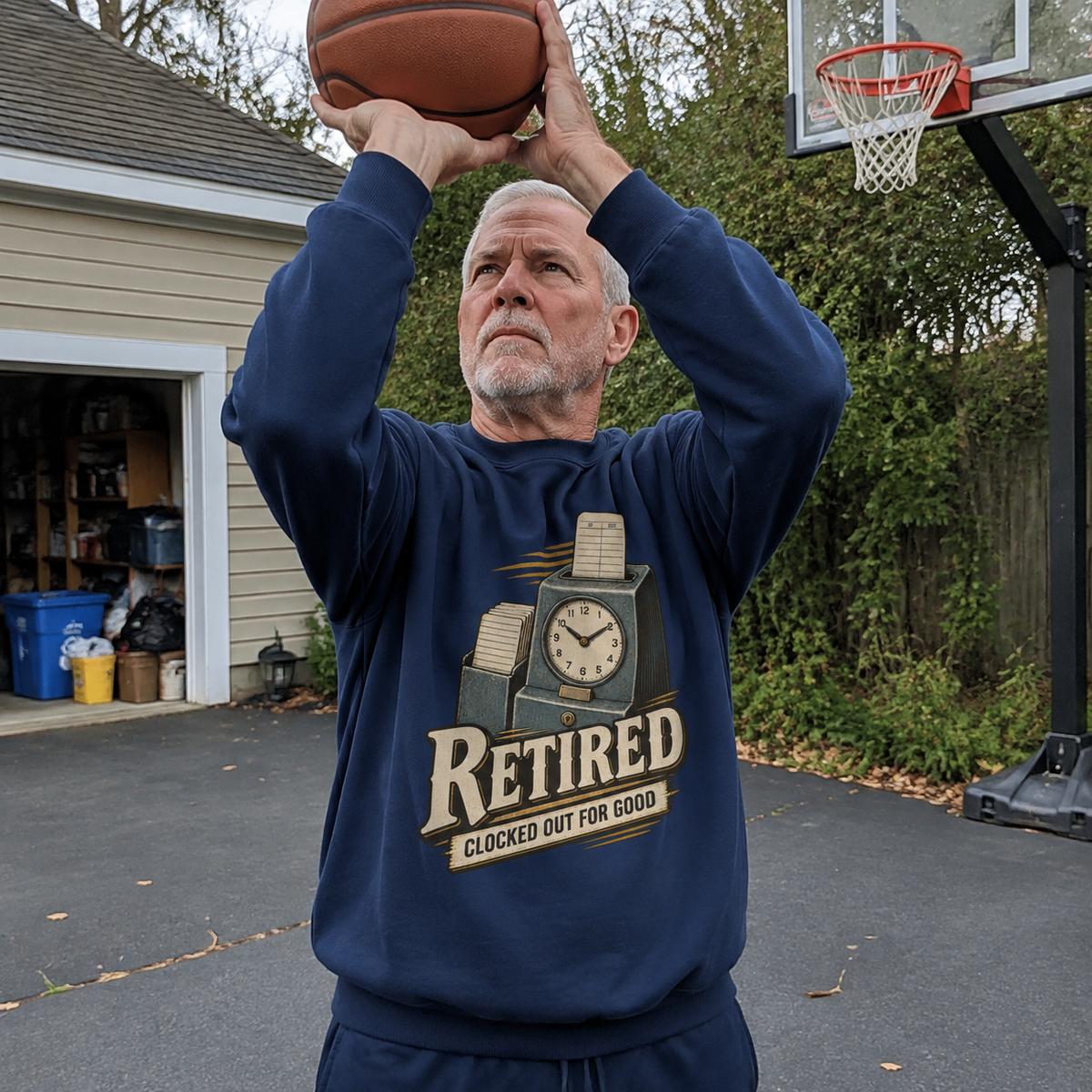 Senior man wearing navy vintage sweatshirt with printed Clocked Out For Good design outdoors