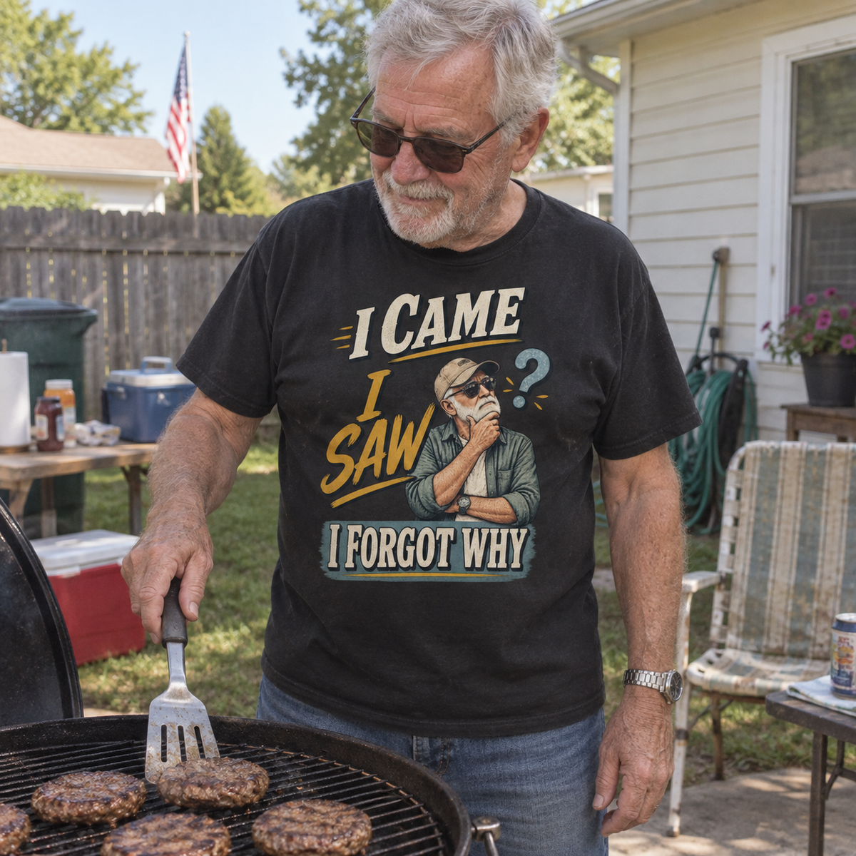 Senior man grilling in black vintage t-shirt printed I Came I Saw I Forgot Why