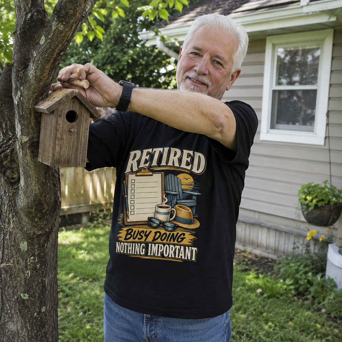 Black vintage t-shirt with “Retired. Busy Doing Nothing Important” print, worn by senior man outdoors.