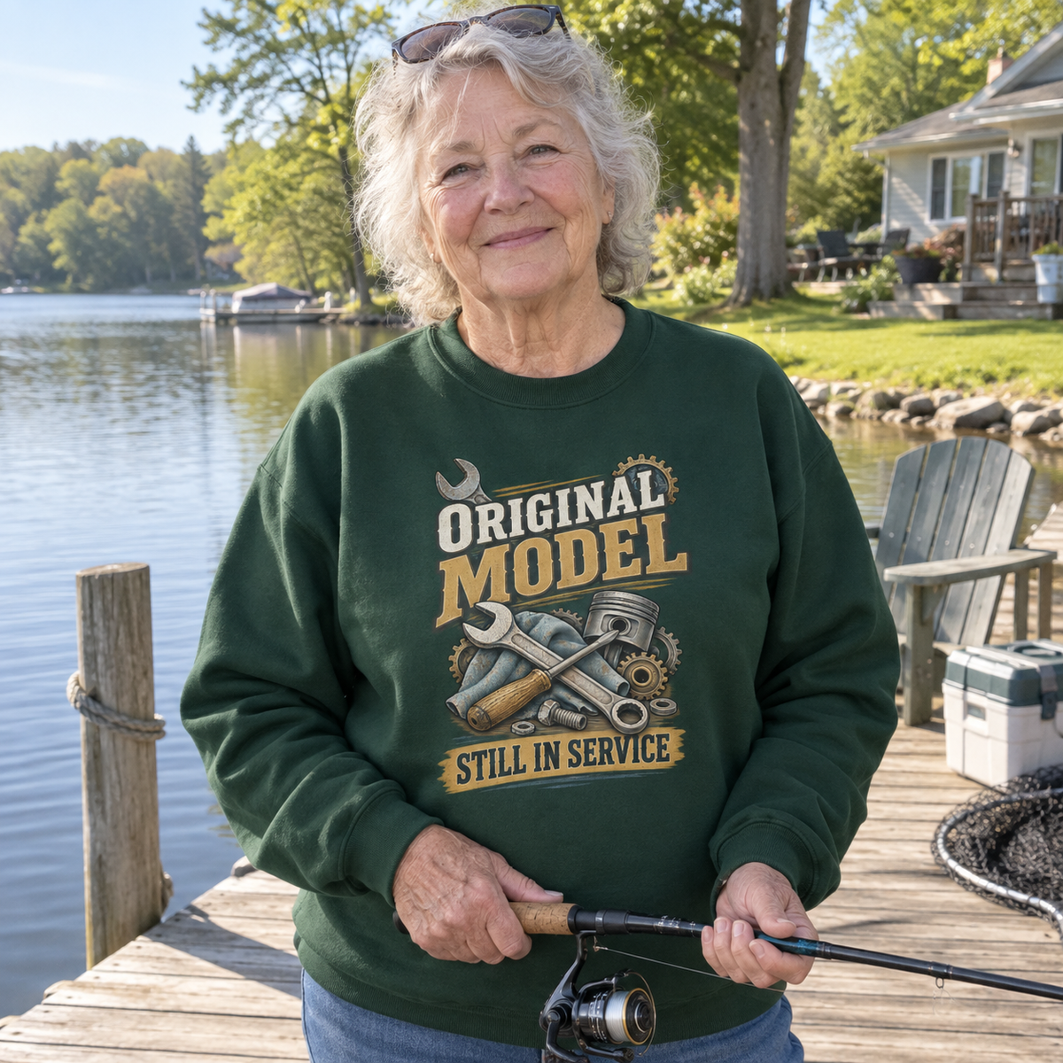 Senior woman fishing lakeside in green vintage sweatshirt printed Original Model Still In Service
