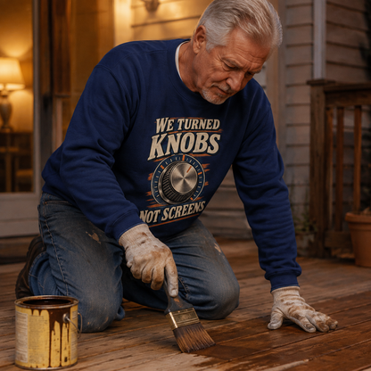Senior man wearing navy vintage sweatshirt with printed We Turned Knobs slogan in lifestyle scene