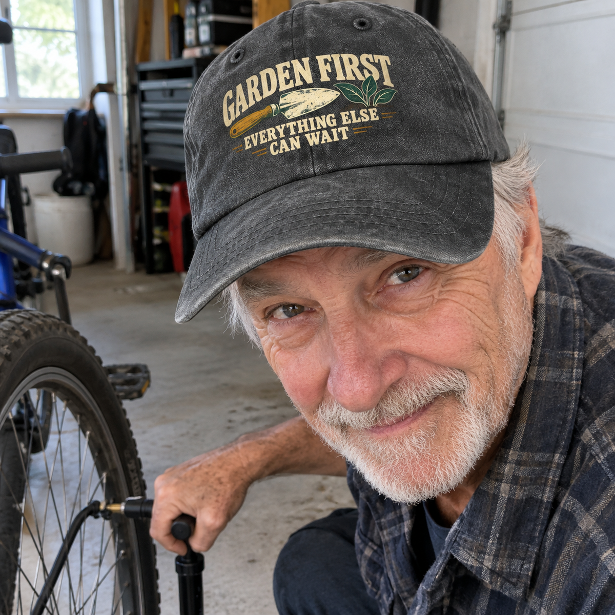 Senior man wearing black vintage washed cap with printed Garden First slogan in garage