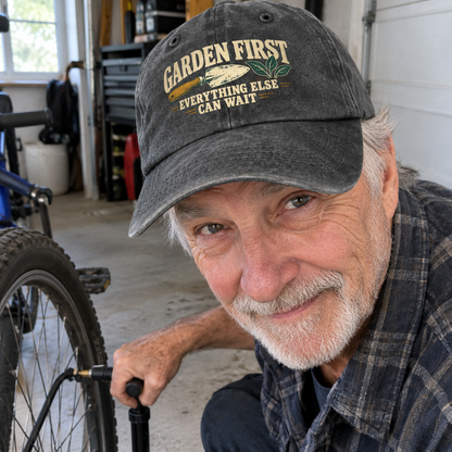Senior man wearing black vintage washed cap with printed Garden First slogan in garage