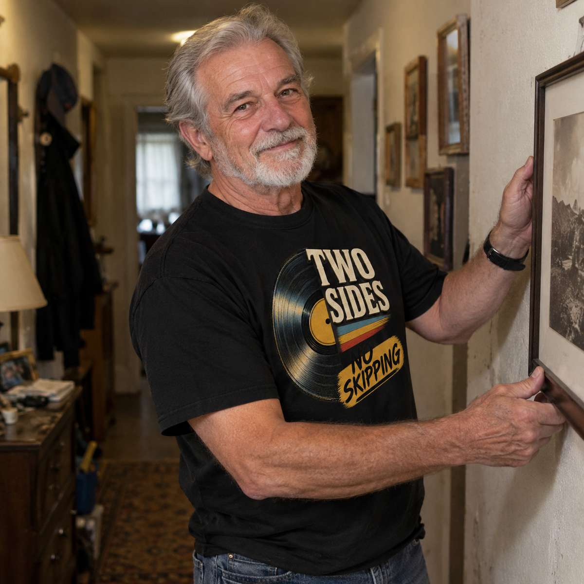 Senior man wears black vintage t-shirt with printed Two Sides No Skipping design