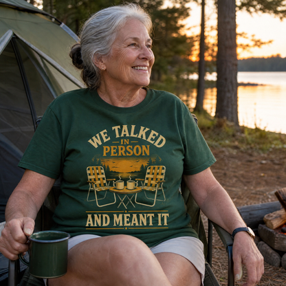 Senior woman wearing green vintage t-shirt with printed We Talked In Person design outdoors
