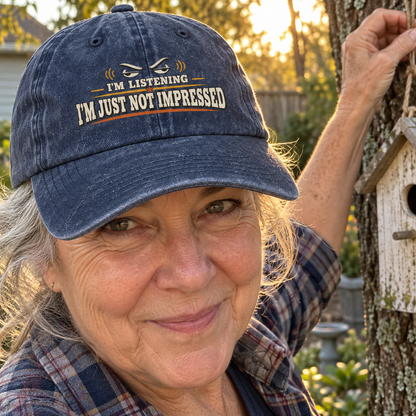 Senior woman outdoors wears navy vintage washed cap printed I'm Listening I'm Just Not Impressed