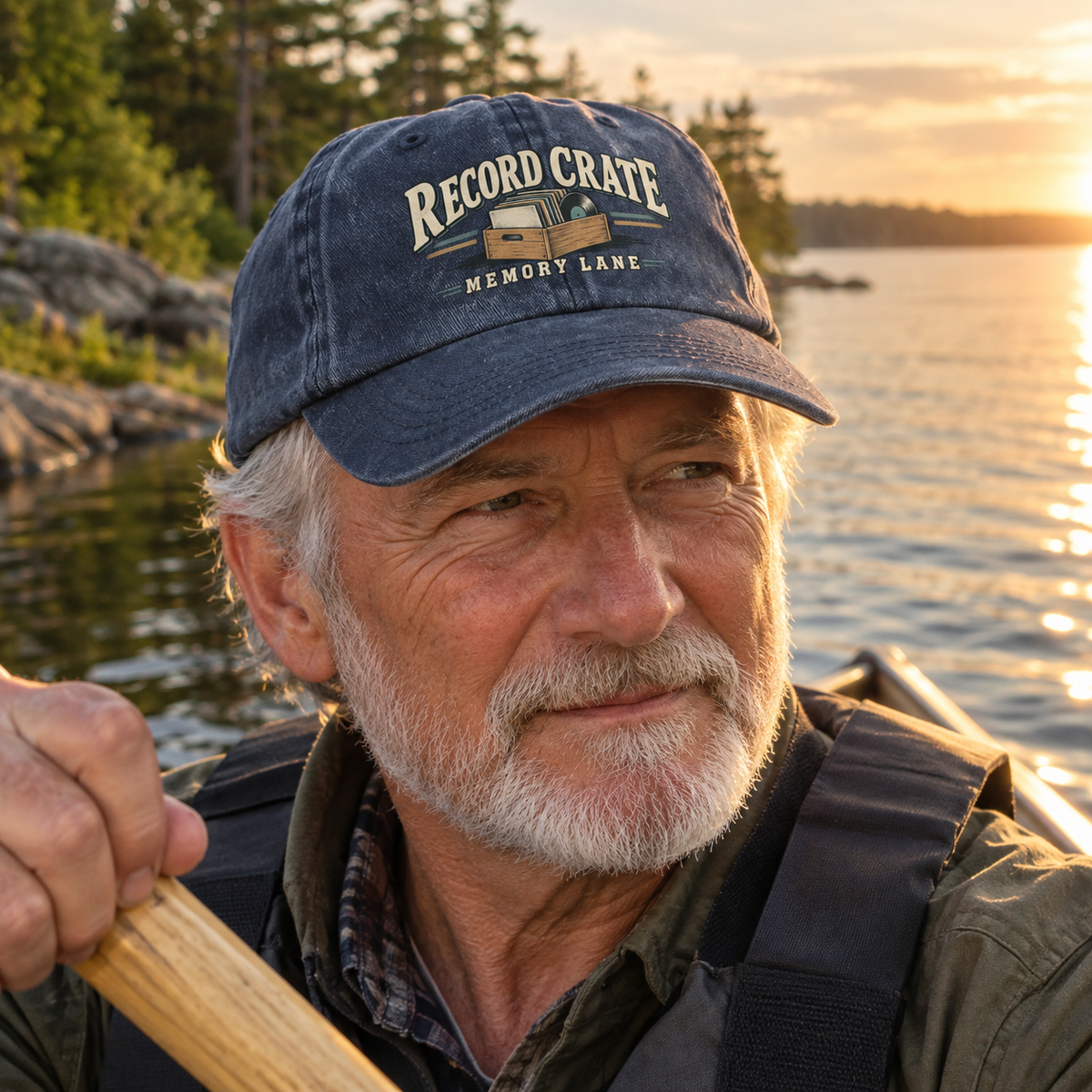Dark vintage washed cap printed Record Crate Memory Lane worn by senior man kayaking at sunset