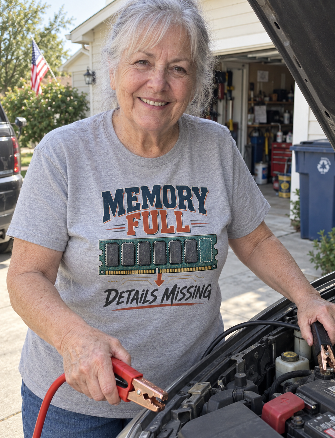 Senior woman wearing gray vintage t-shirt with printed Memory Full Details Missing design beside car.