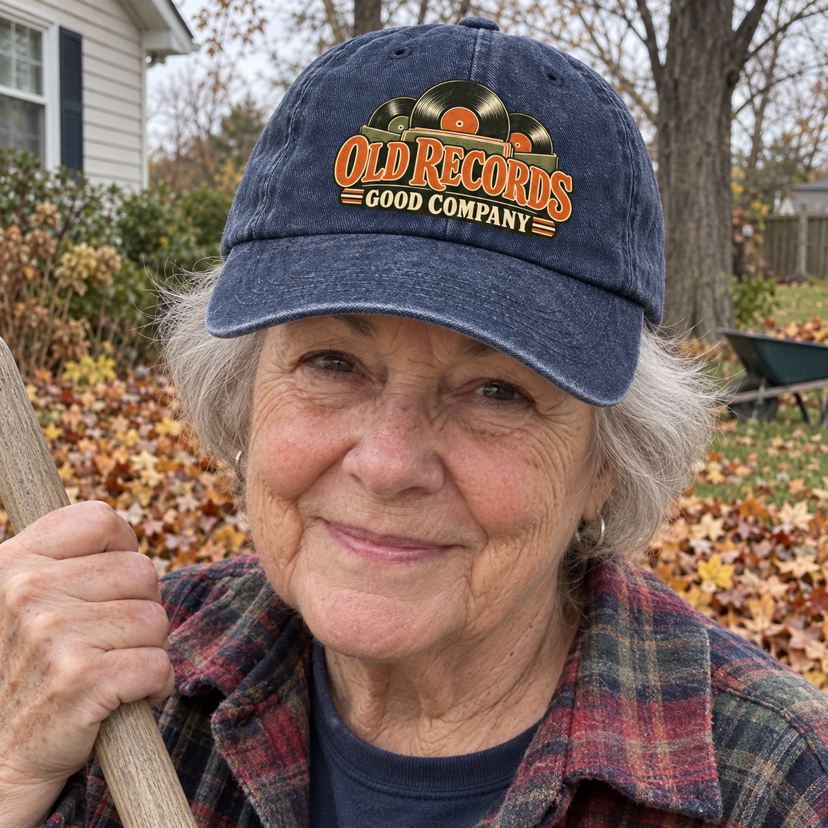 Senior woman outdoors wearing navy vintage washed cap with printed Old Records Good Company design