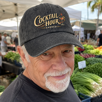 Senior man wearing black vintage washed cap with printed Cocktail Hour Earned design outdoors