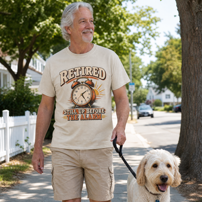Senior man wearing vintage t-shirt printed “Retired Still Up Before The Alarm” walking dog