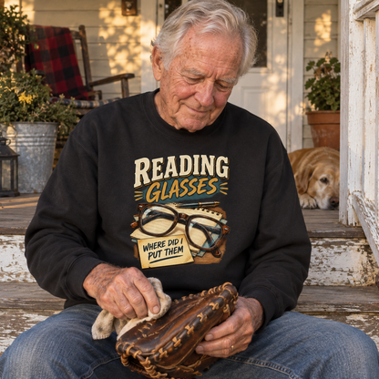 Senior man wears black vintage sweatshirt printed with Reading Glasses Where Did I Put Them
