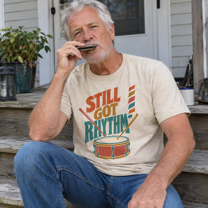 Senior man wearing cream vintage t-shirt with printed Still Got Rhythm design, lifestyle view