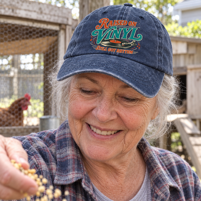 Senior woman wears navy vintage washed cap printed Raised On Vinyl Still Got Rhythm