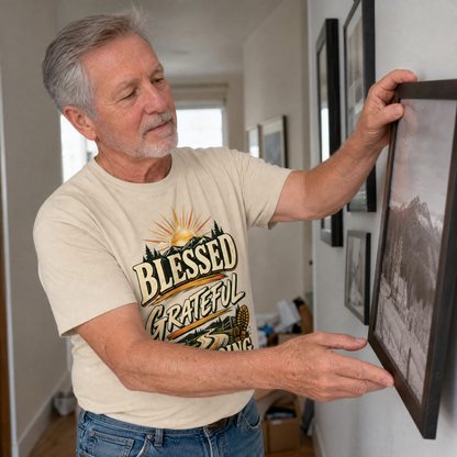 Senior man wearing beige vintage t-shirt with Blessed Grateful Still Going print indoors