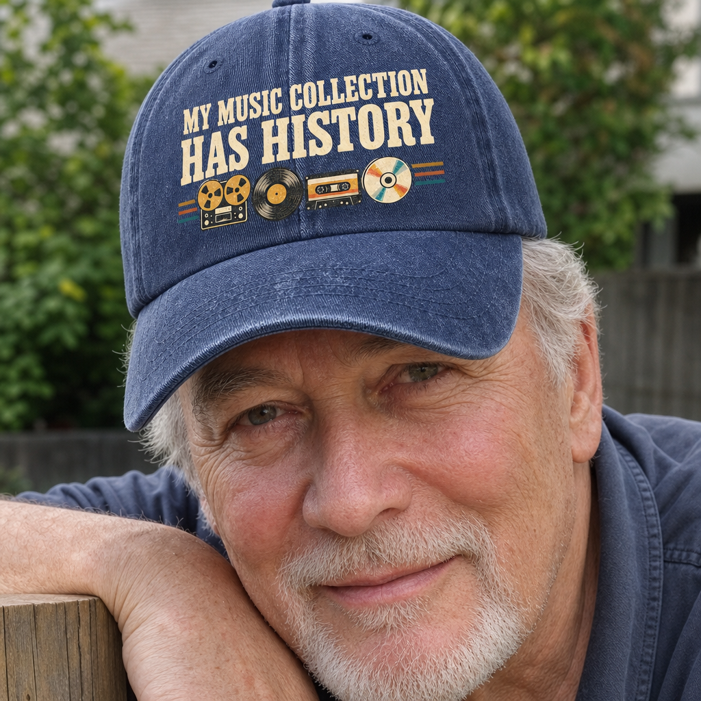 Blue vintage washed cap with printed music slogan worn by senior man outdoors.