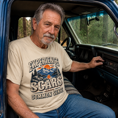 Vintage t-shirt with printed Experience Scars Common Sense design worn by senior man in truck