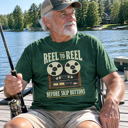Senior man wearing green vintage t-shirt with reel-to-reel design while fishing by a lake