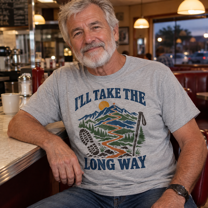 Senior man wearing gray vintage t-shirt with I’ll Take The Long Way mountain print, diner.