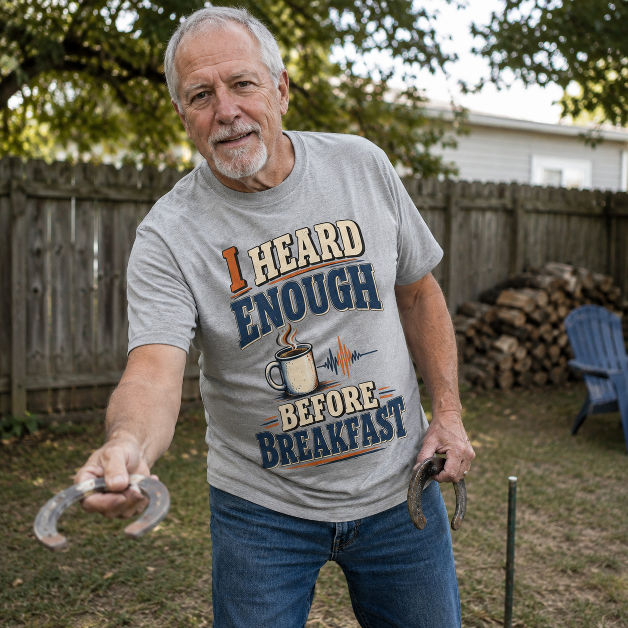 Senior man wearing gray vintage t-shirt with printed I Heard Enough Before Breakfast slogan outdoors