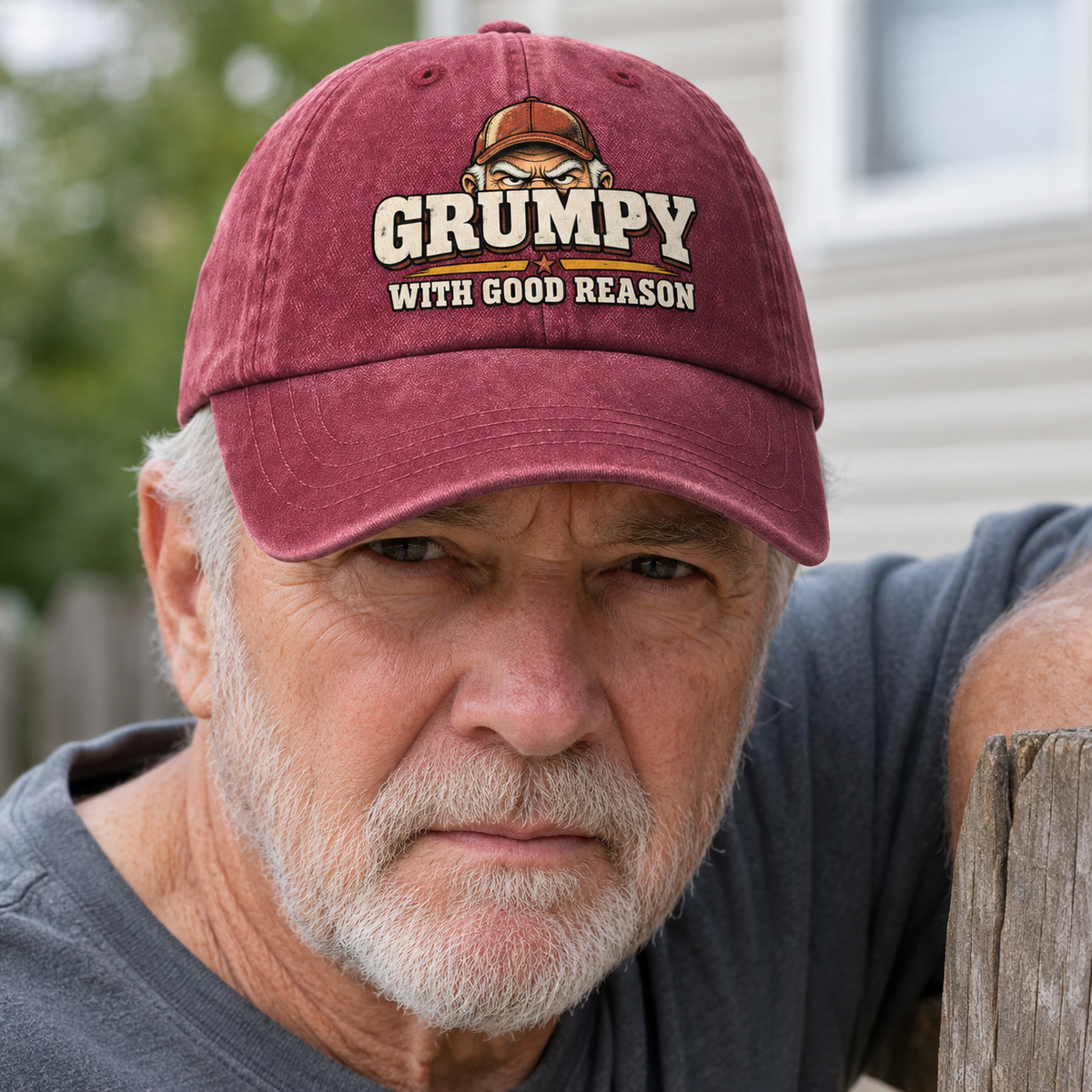 Senior man wearing maroon vintage washed cap with printed Grumpy With Good Reason slogan