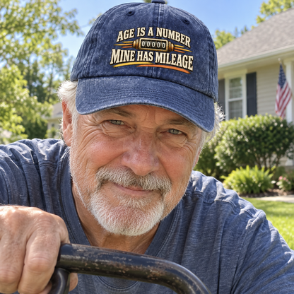 Senior man wearing navy vintage washed cap printed Age Is A Number Mine Has Mileage