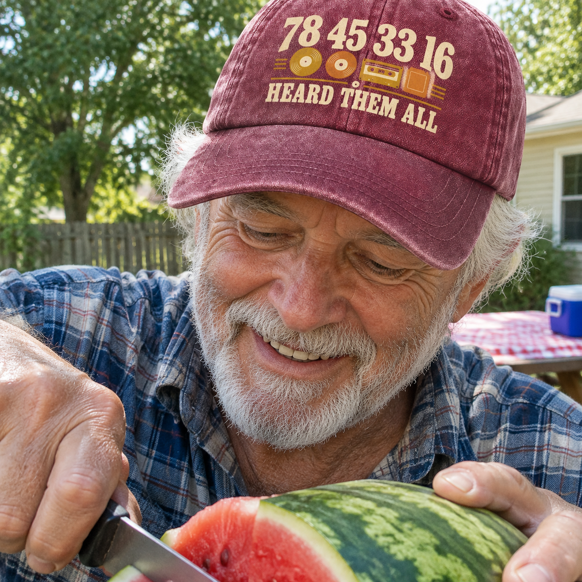 Senior man wearing burgundy vintage washed cap with printed Heard Them All design outdoors