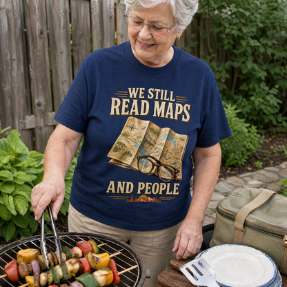 Vintage t-shirt with printed “We Still Read Maps And People” design worn by senior woman