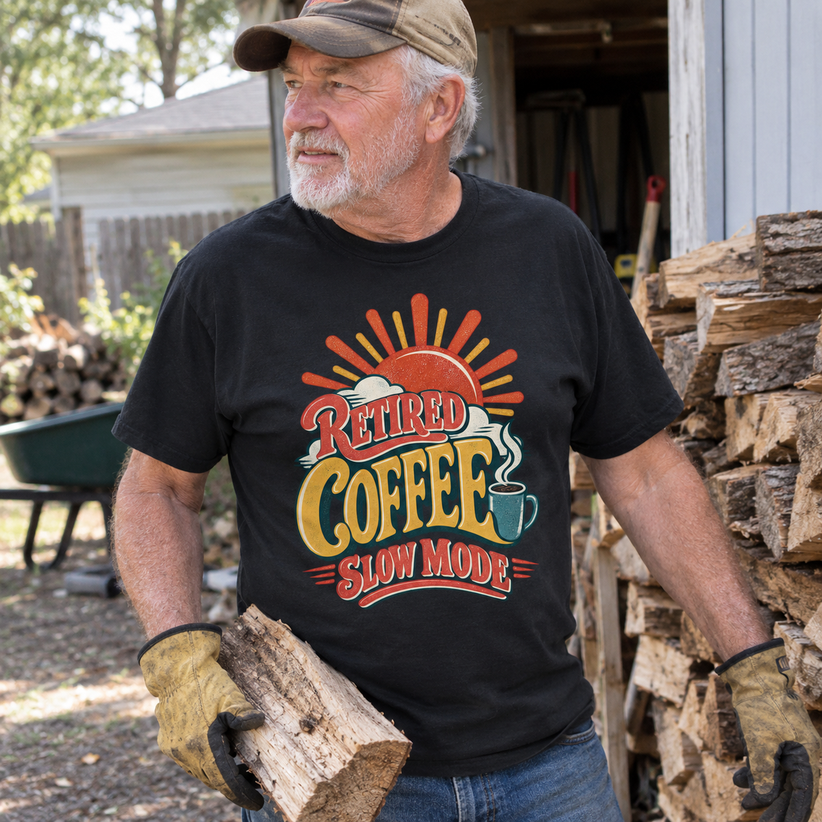 Senior man wearing black vintage t-shirt reading Retired Coffee Slow Mode outdoors