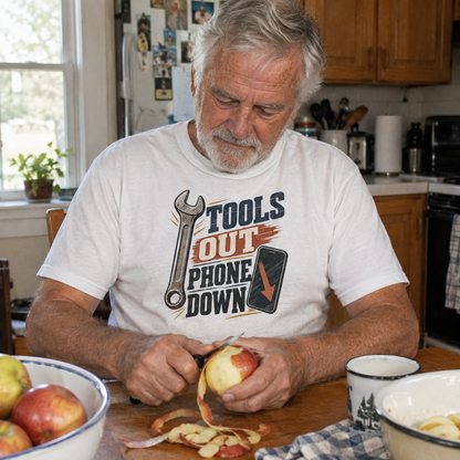 Senior wearing vintage t-shirt with Tools Out. Phone Down printed design