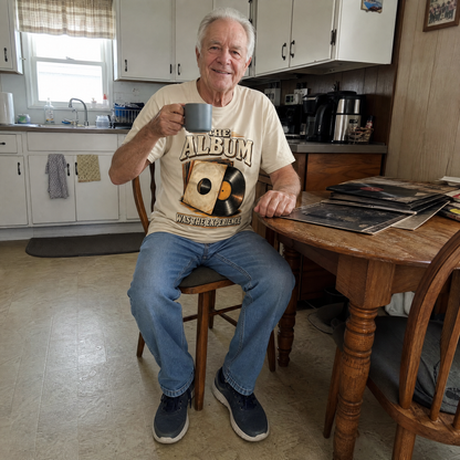 Senior man wearing a cream vintage t-shirt with The Album Was The Experience print