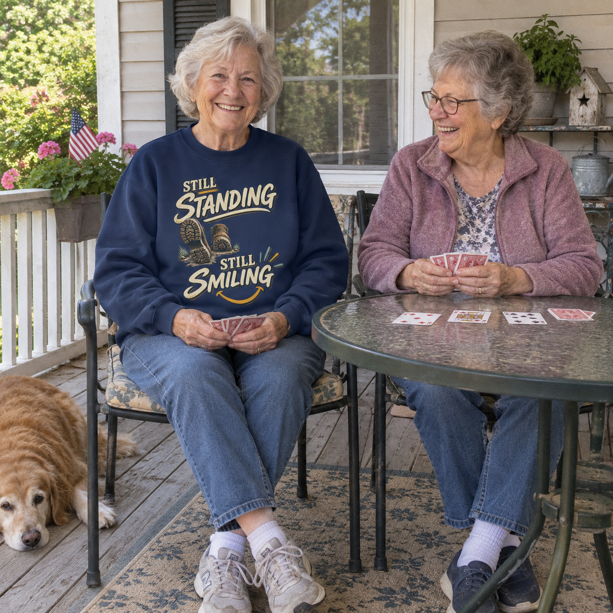 Senior woman wearing navy vintage sweatshirt with printed Still Standing Still Smiling design.