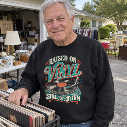 Senior man browsing records wears black vintage sweatshirt printed Raised On Vinyl Still Got Rhythm