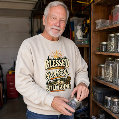 Senior man wearing cream vintage sweatshirt with printed Blessed Grateful Still Going design