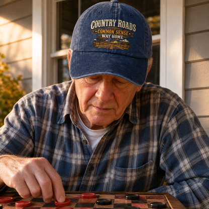 Senior man wearing blue vintage washed cap with Country Roads printed design outdoors