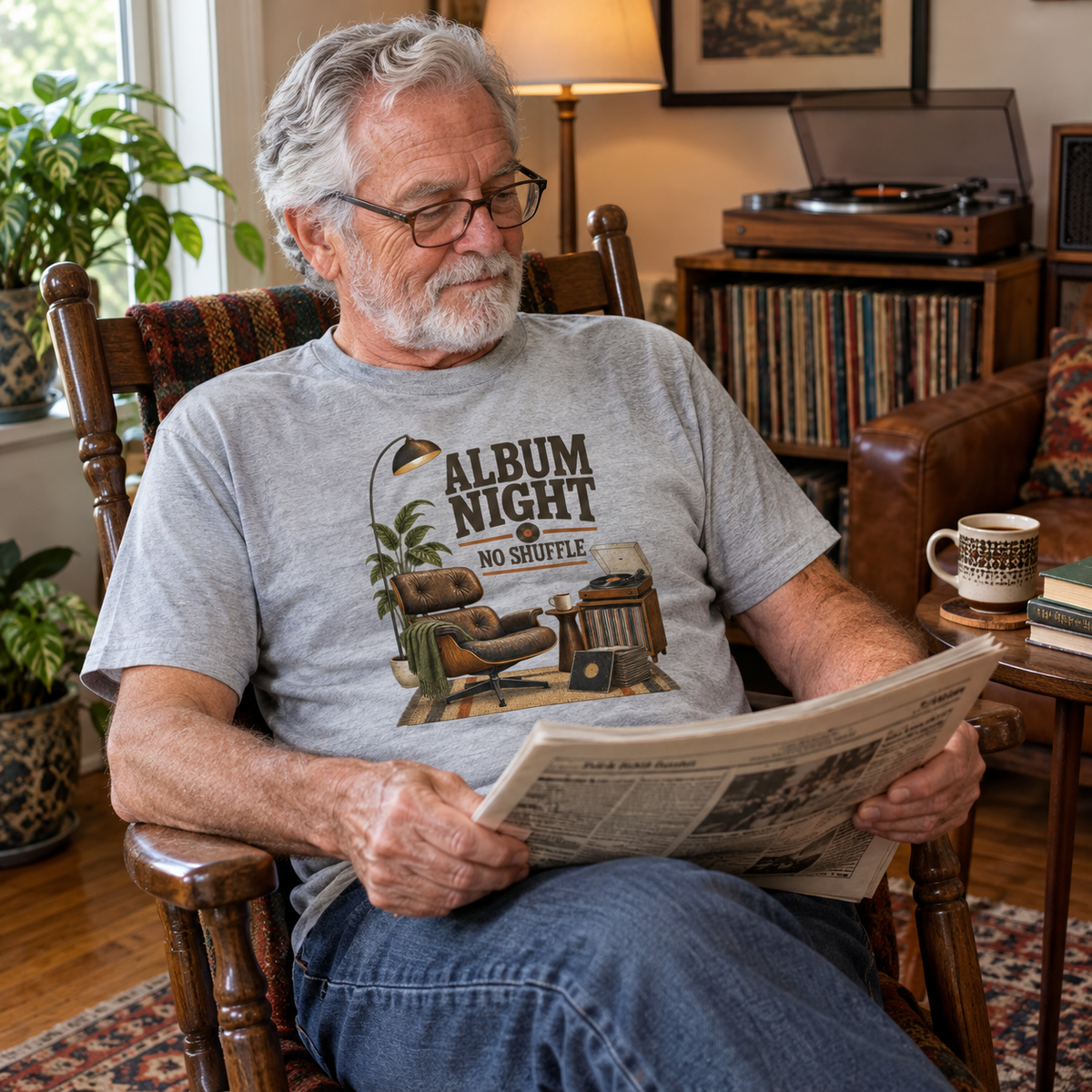 Gray vintage t-shirt with printed Album Night. No Shuffle design, worn by senior man.