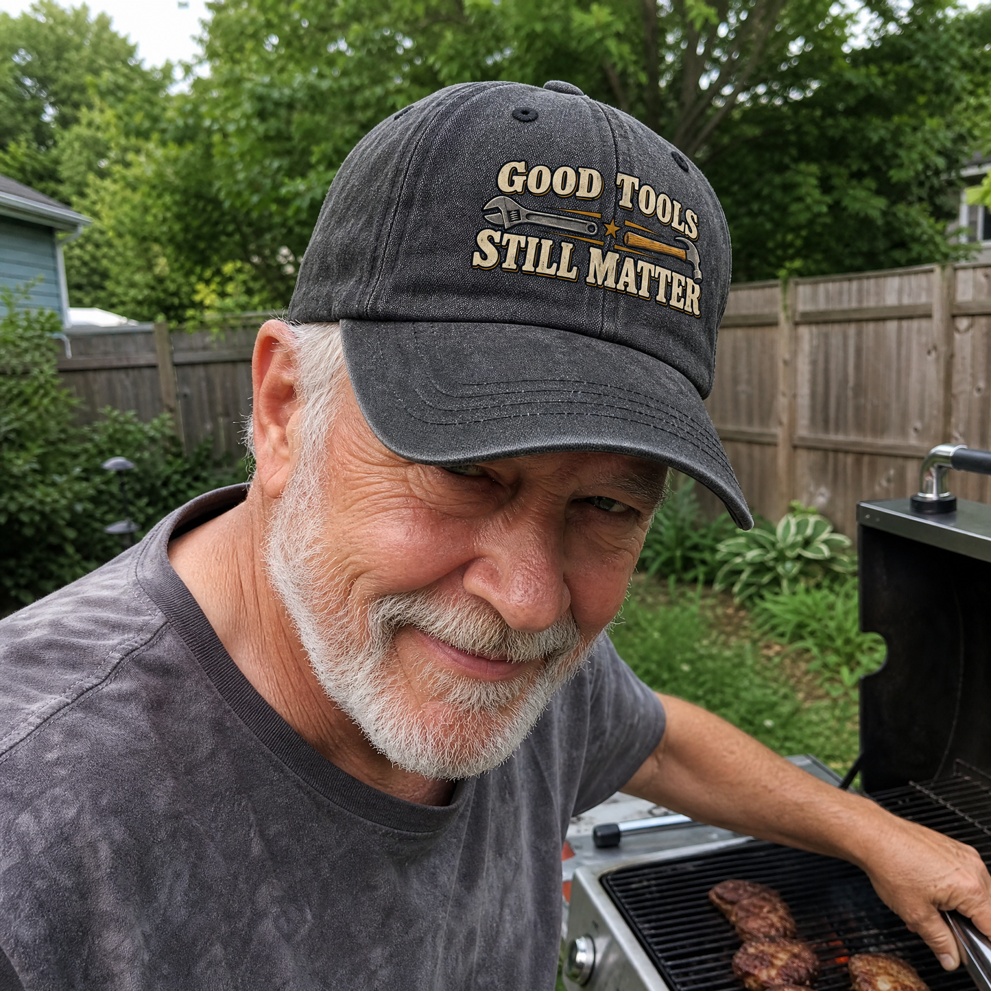 Vintage washed cap with printed Good Tools Still Matter design, worn by senior man outdoors