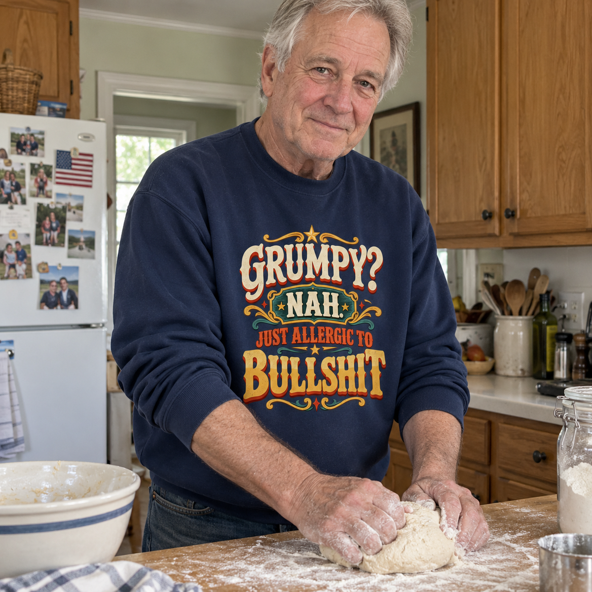 Senior man kneads dough wearing navy vintage sweatshirt printed Grumpy? Nah. Just Allergic To Bullshit