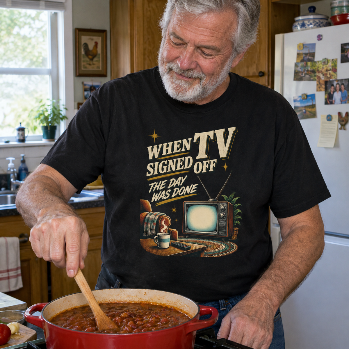 Senior wearing vintage t-shirt with When TV Signed Off The Day Was Done printed design