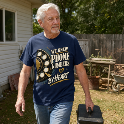 Senior man wearing navy vintage t-shirt with printed “We Knew Phone Numbers By Heart” design outdoors